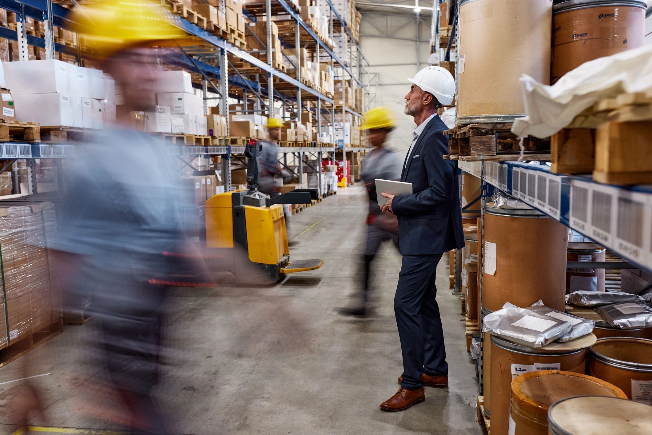 Foreman in distribution warehouse planning quality checks