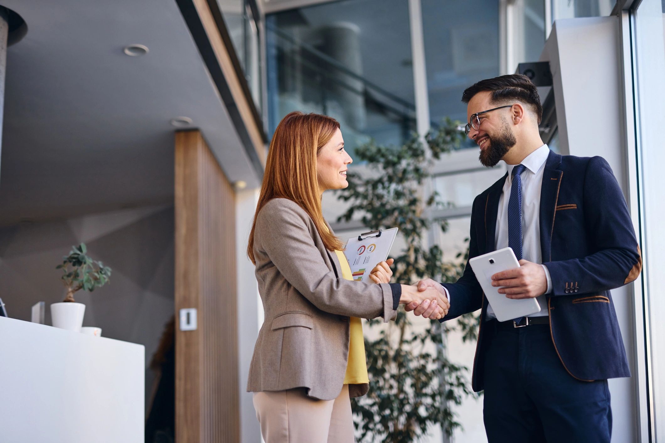 Businesspeople shaking hands after successful meeting